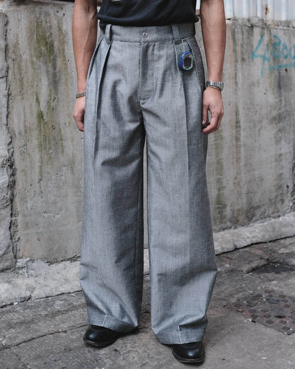 MEG.S 007 Pleated Chino in grey wool-silk blend, wide-leg with front pleats and ball-drop zipper fly.