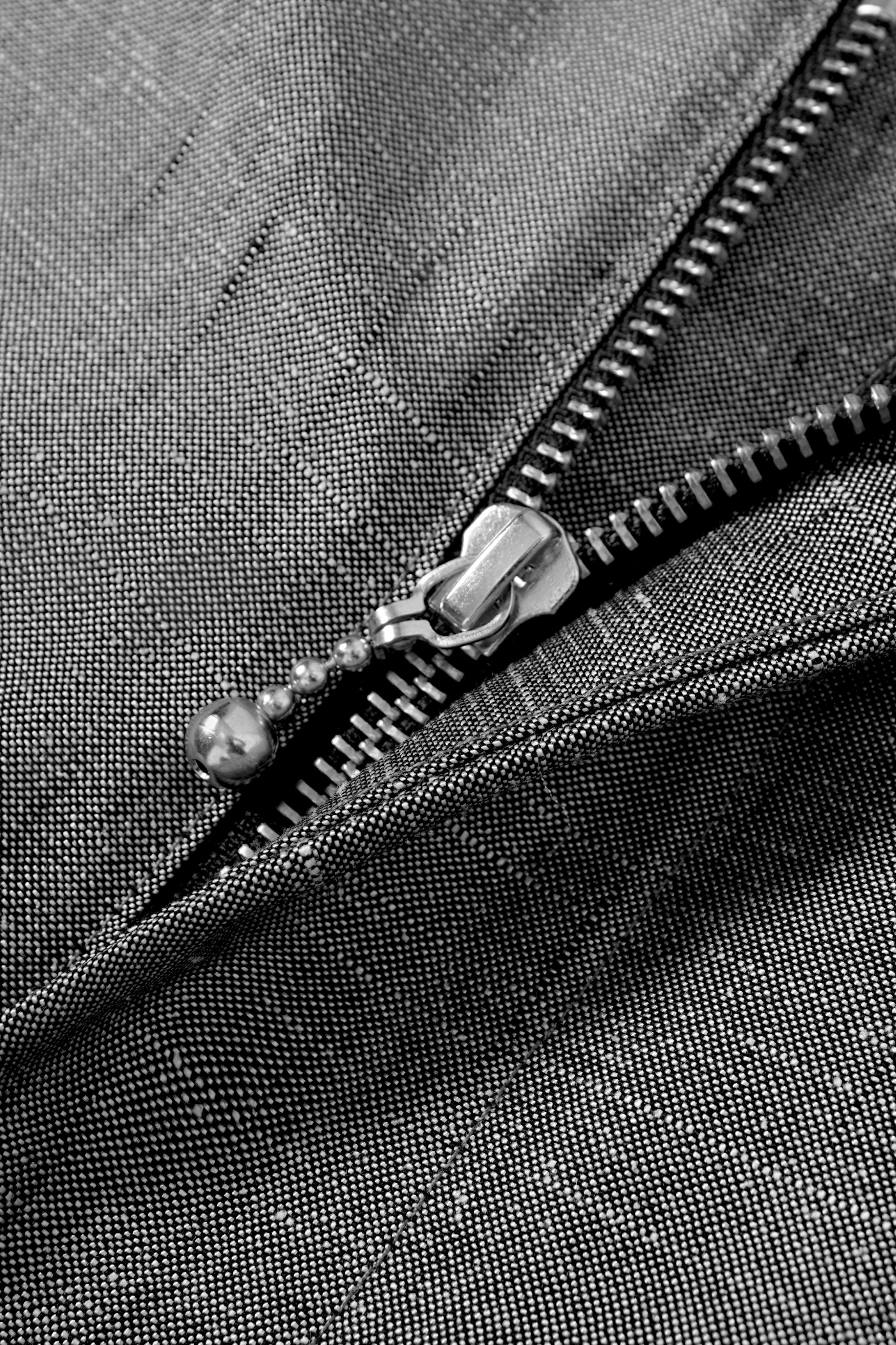 MEG.S 007 Pleated Chino in grey wool-silk blend with a ball-drop zipper fly and subtle lustrous finish.