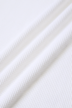 MEG.S white 100% cotton long sleeve waffle knit shirt with wide neck and split hem.