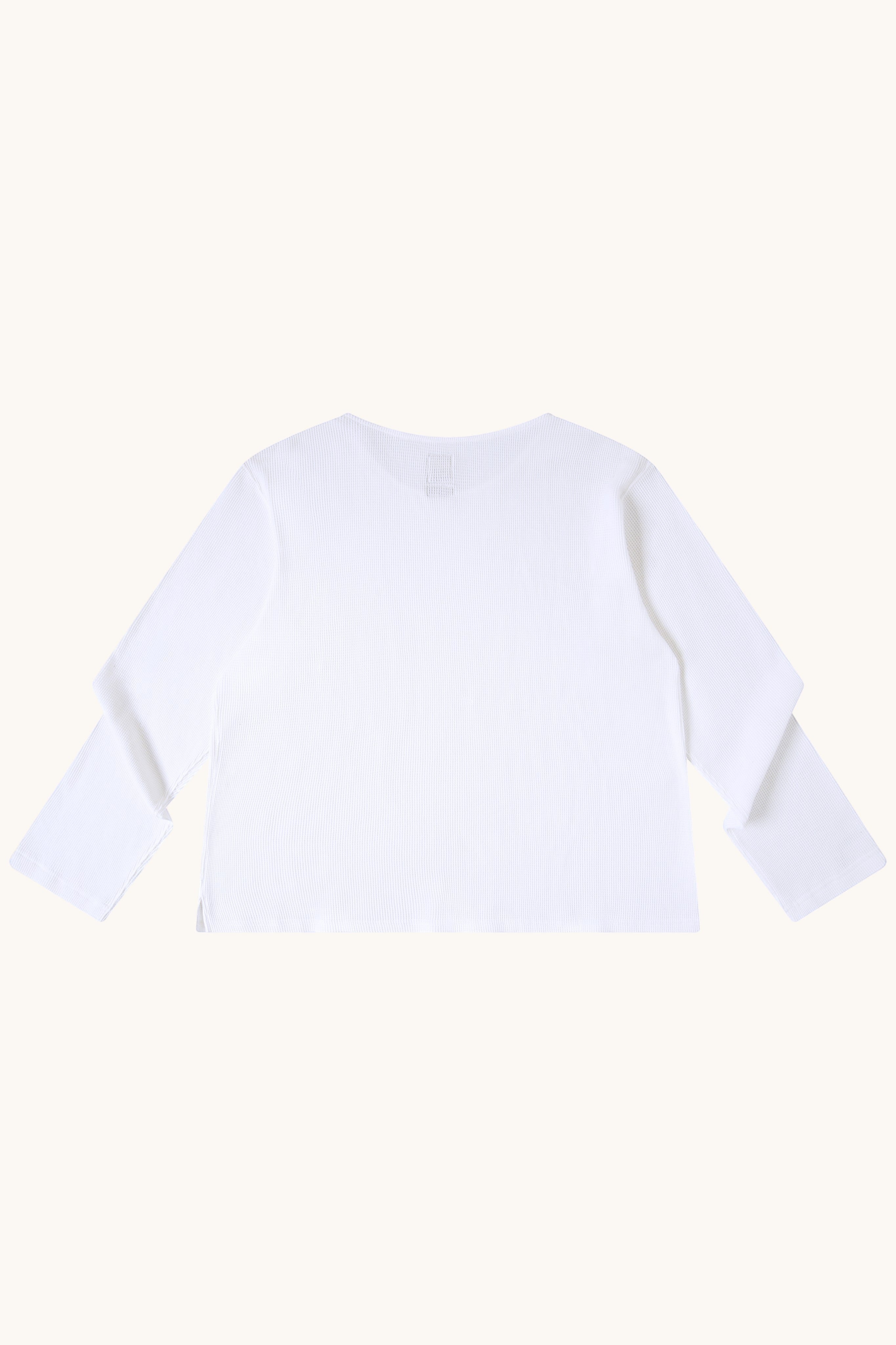 MEG.S white 100% cotton waffle knit long sleeve shirt with wide neck and split hem.
