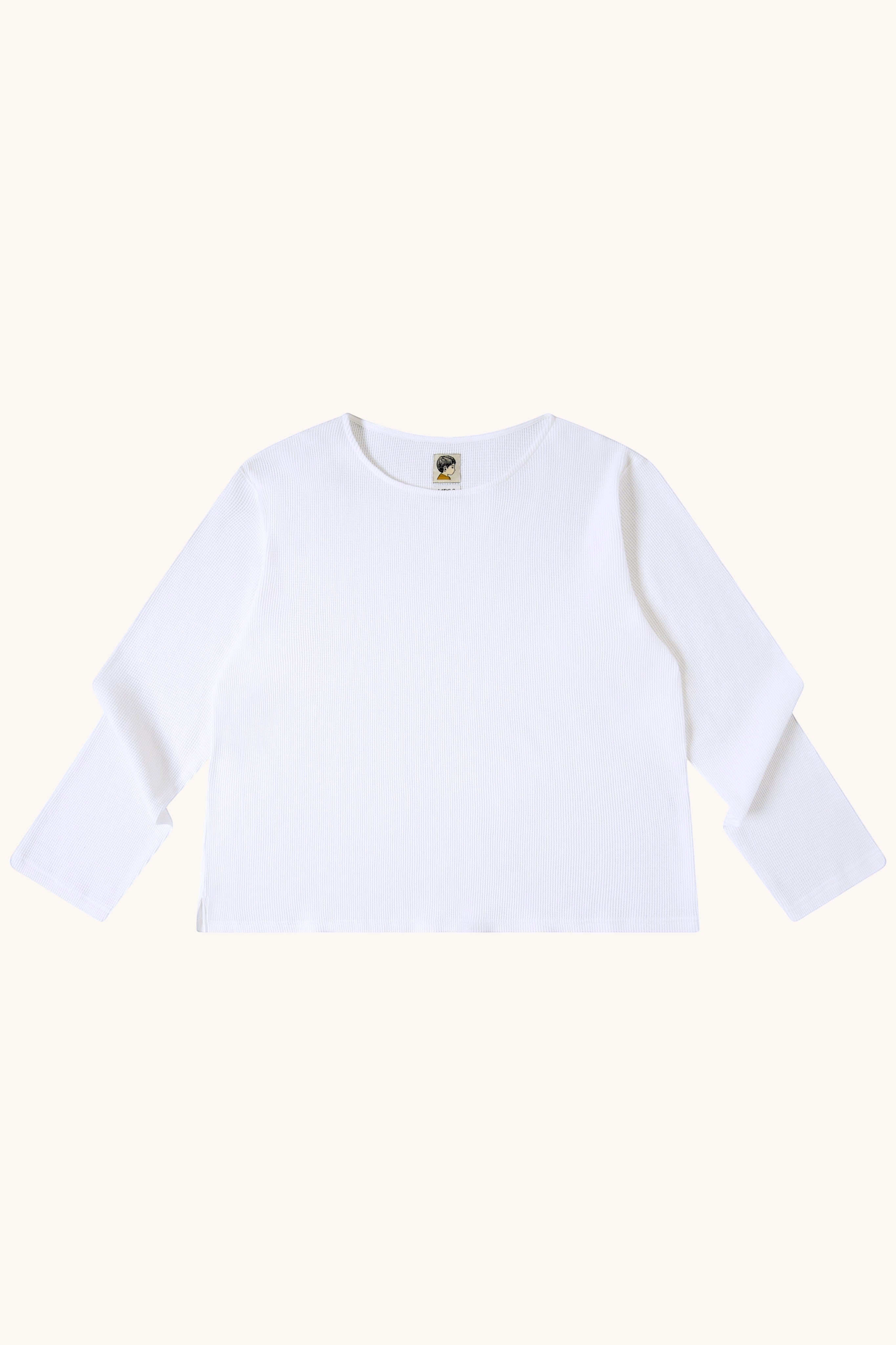 MEG.S white 100% cotton long sleeve waffle knit shirt with a wide neckline and split hem.